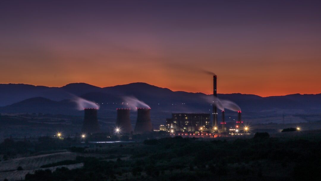 Heavy industry conglomerate production plant at sunset