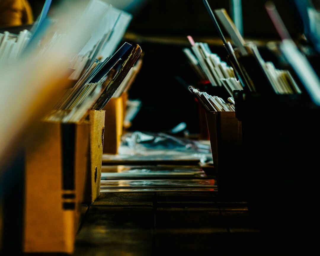 Stack of paper documents and folders on a desk