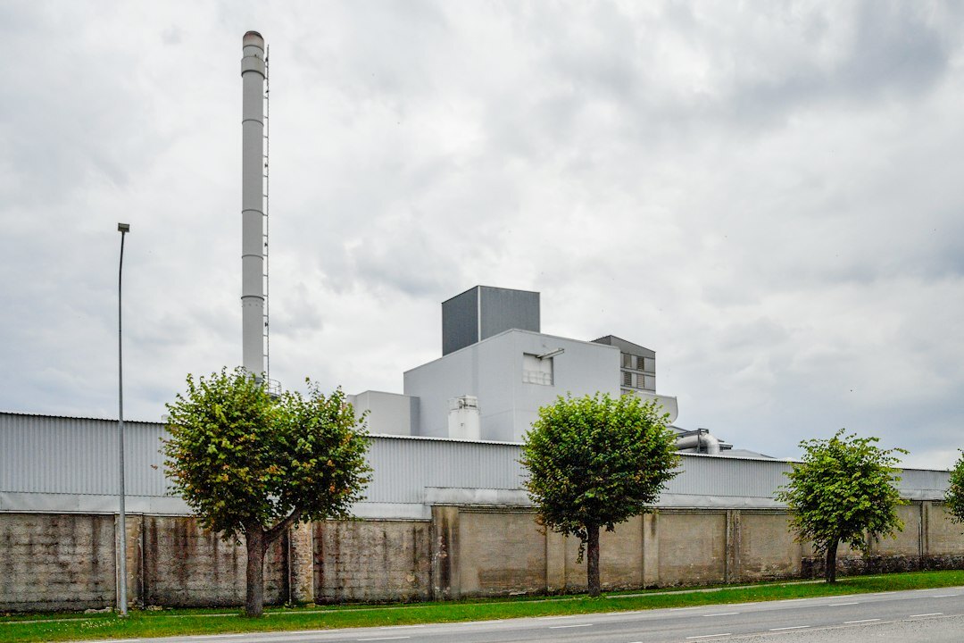Industrial manufacturing facility exterior with smokestacks